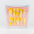 Buy  Aurora Bloom press on nails in Almond shape, Holiday, Party theme, yellow colour and Long length.
