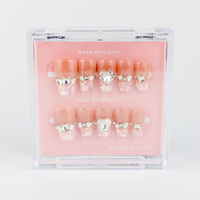 Buy Crystal Heart press on nails in Coffin shape, Party theme, nude,peach colour and Short length.
