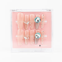 Buy  Diamond Dream press on nails in Coffin shape, Party, Brights, Casual theme, peach colour and Long length.

