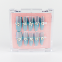 Buy  Glacier Bloom press on nails in Oval shape, Party theme, Blue colour and Long length.
