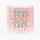 Buy Glimmer Queen press on nails in Almond shape, Party theme, silver colour and Long length.
