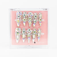 Buy Glimmer Queen press on nails in Almond shape, Party theme, silver colour and Long length.
