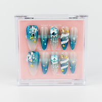 Buy Glimmering Coral press on nails in Oval, Almond shape, Holiday, Party theme, Blue colour and Long length.
