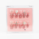 Buy  Glitter Glam press on nails in Squaoval shape, Brights, Holiday theme, nude,silver colour and Medium length.
