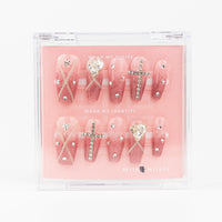 Buy  Glitter Glam press on nails in Squaoval shape, Brights, Holiday theme, nude,silver colour and Medium length.

