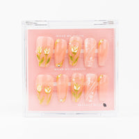 Buy  Golden Spring press on nails in Coffin shape, Brights, Holiday, Party theme, Nude colour and Long length.
