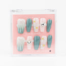 Buy Mermaid's Secret press on nails in Coffin shape, Holiday theme, green, nude colour and Medium length.