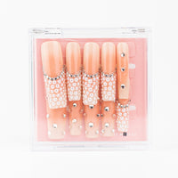 Buy  Pearl Pop press on nails in Square shape, Party theme, Peach colour and Long length.
