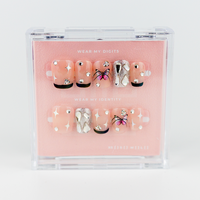 Buy Pixie stones press on nails in Squaoval shape, Party theme, nude,silver black colour and Medium length.
