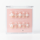 Buy Sakura Bloom press on nails in Coffin shape, Holiday, Neutrals theme, nude,white colour and Long length.
