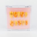 Buy Sunstone swirl press on nails in Coffin shape, Party, Holiday theme, yellow, gold colour and Medium length.