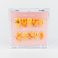 Buy Sunstone swirl press on nails in Coffin shape, Party, Holiday theme, yellow, gold colour and Medium length.